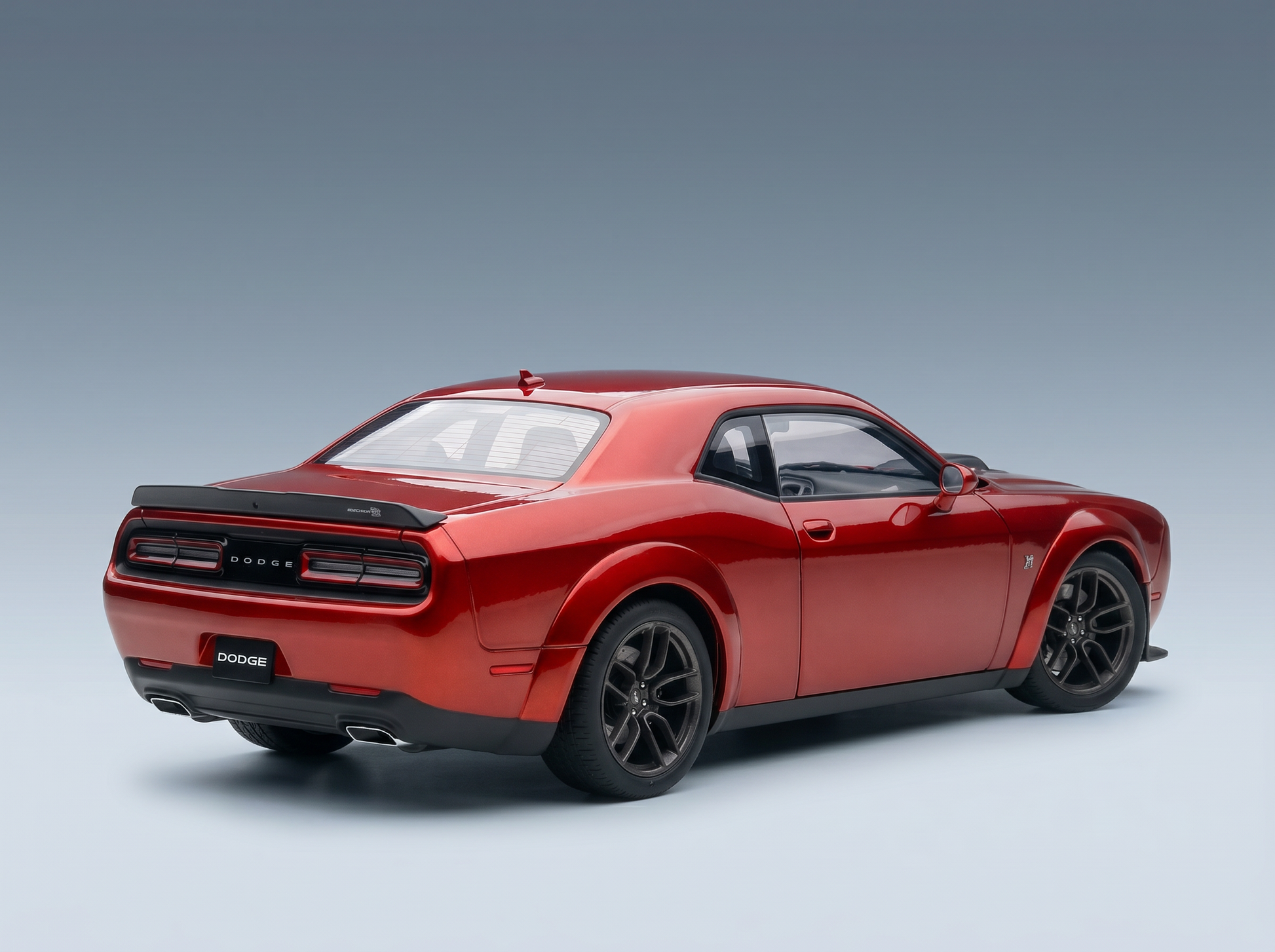 Red Dodge Challenger scale model car from Vroomi, showcasing sleek design and black rims.