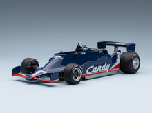 Candy-liveried 1/18 scale model car with Goodyear tires, showcased by Vroomi for collectors.