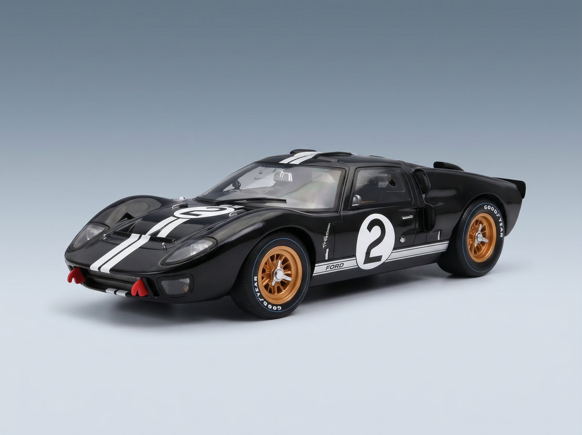 Black Ford GT40 scale model car with white racing stripes, number 2, gold wheels — Vroomi