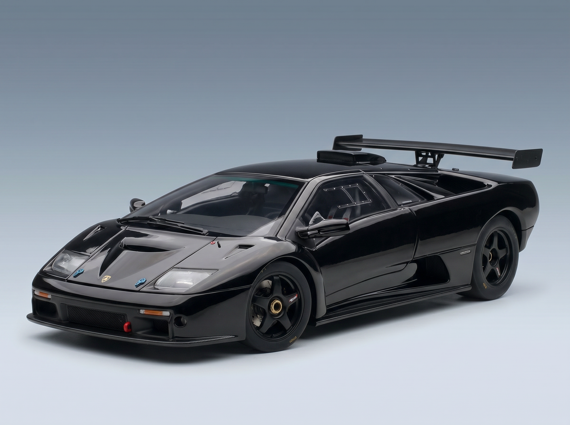 Black Lamborghini Diablo GT scale model car with rear wing, showcased by Vroomi for collectors.