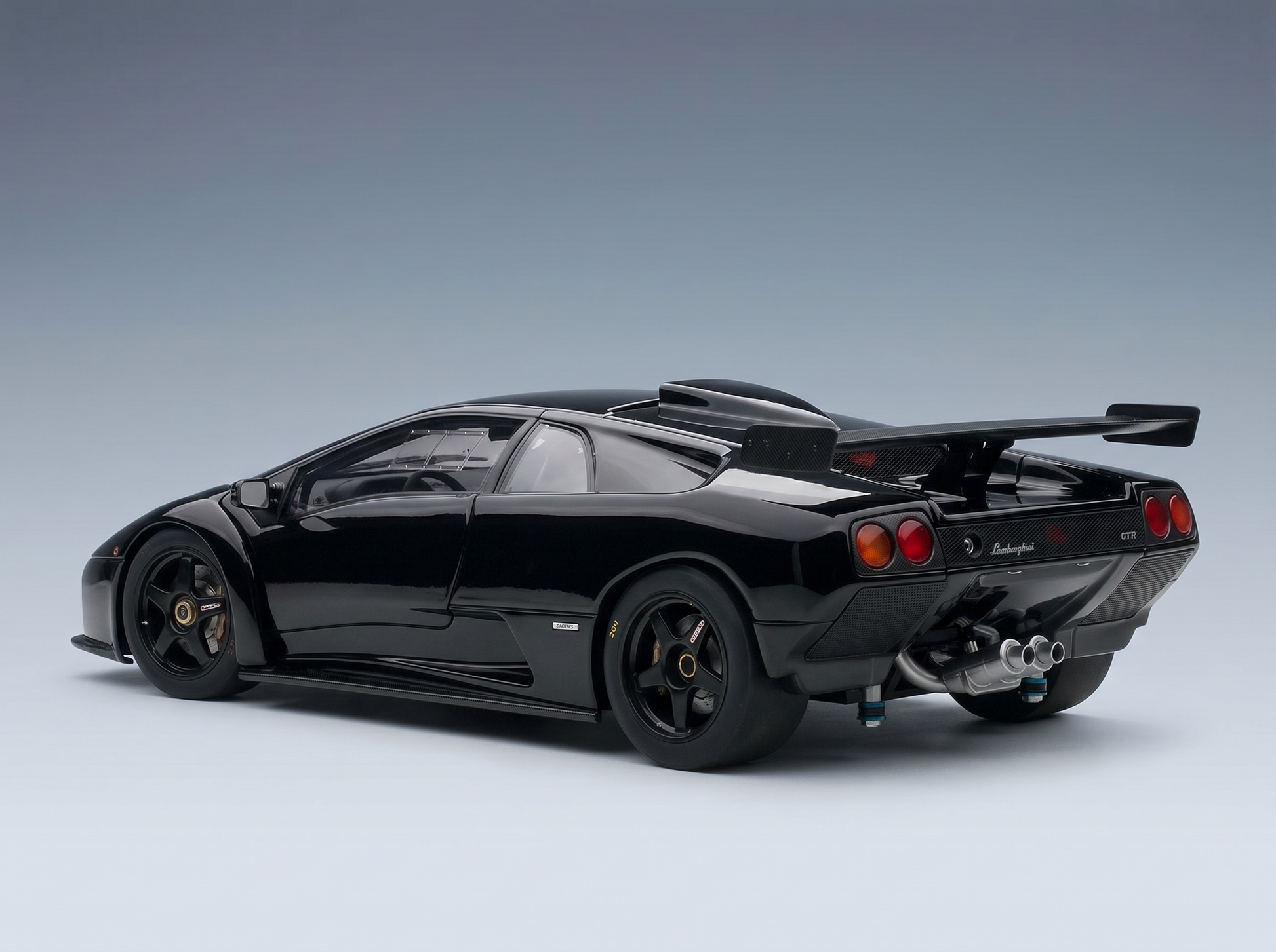 Black Lamborghini Diablo GTR scale model car with rear wing, showcased by Vroomi for collectors.