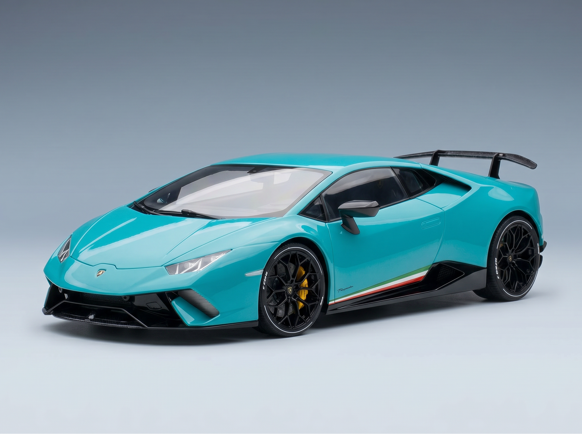 Turquoise Lamborghini Huracán Performante scale model car with black accents, showcased by Vroomi