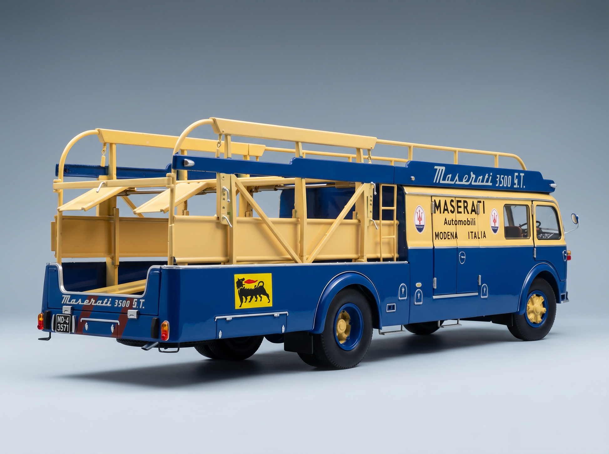 Blue and yellow Maserati 3500 S.T. scale model car transporter by Vroomi, detailed with Italian branding.