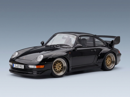 Black Porsche 911 GT2 scale model car with gold rims, showcased by Vroomi for collectors.