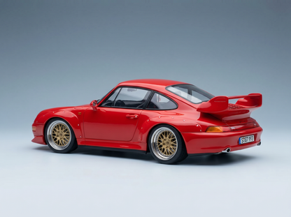 Red Porsche 911 GT2 scale model car with gold rims, showcased by Vroomi for collectors.