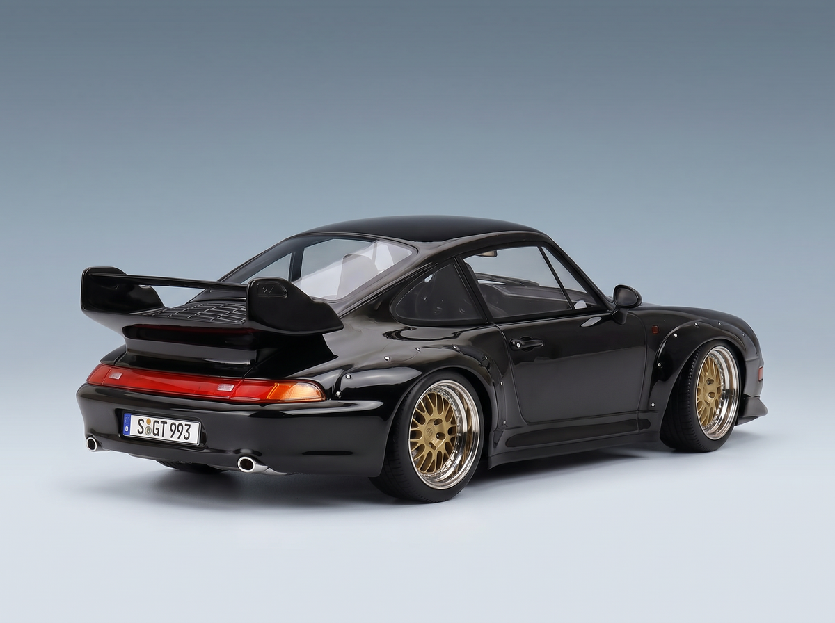 Black Porsche 911 GT2 scale model car with gold rims, rear wing, and S GT 993 plate — Vroomi