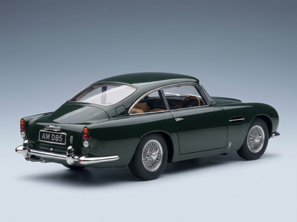 Green Aston Martin DB5 scale model car with wire wheels, showcased by Vroomi for collectors