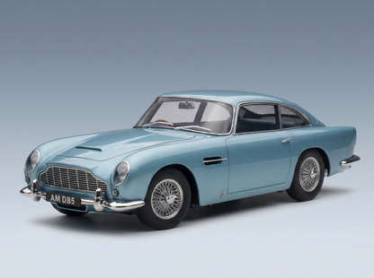 Light blue Aston Martin DB5 scale model car with wire wheels, showcased by Vroomi for collectors.