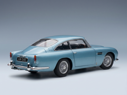 Blue Aston Martin DB5 scale model car from Vroomi, showcasing classic design and wire wheels.