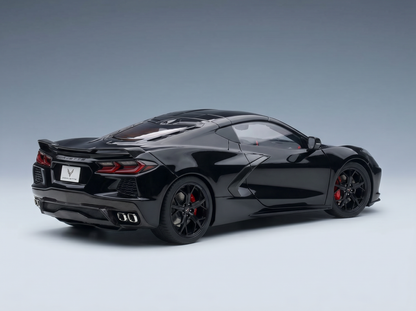 Black Corvette scale model car with red brake calipers, showcased by Vroomi for collectors.