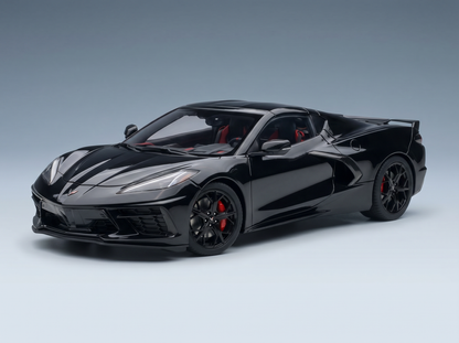 Black Corvette scale model car with red accents, showcased by Vroomi for collectors.
