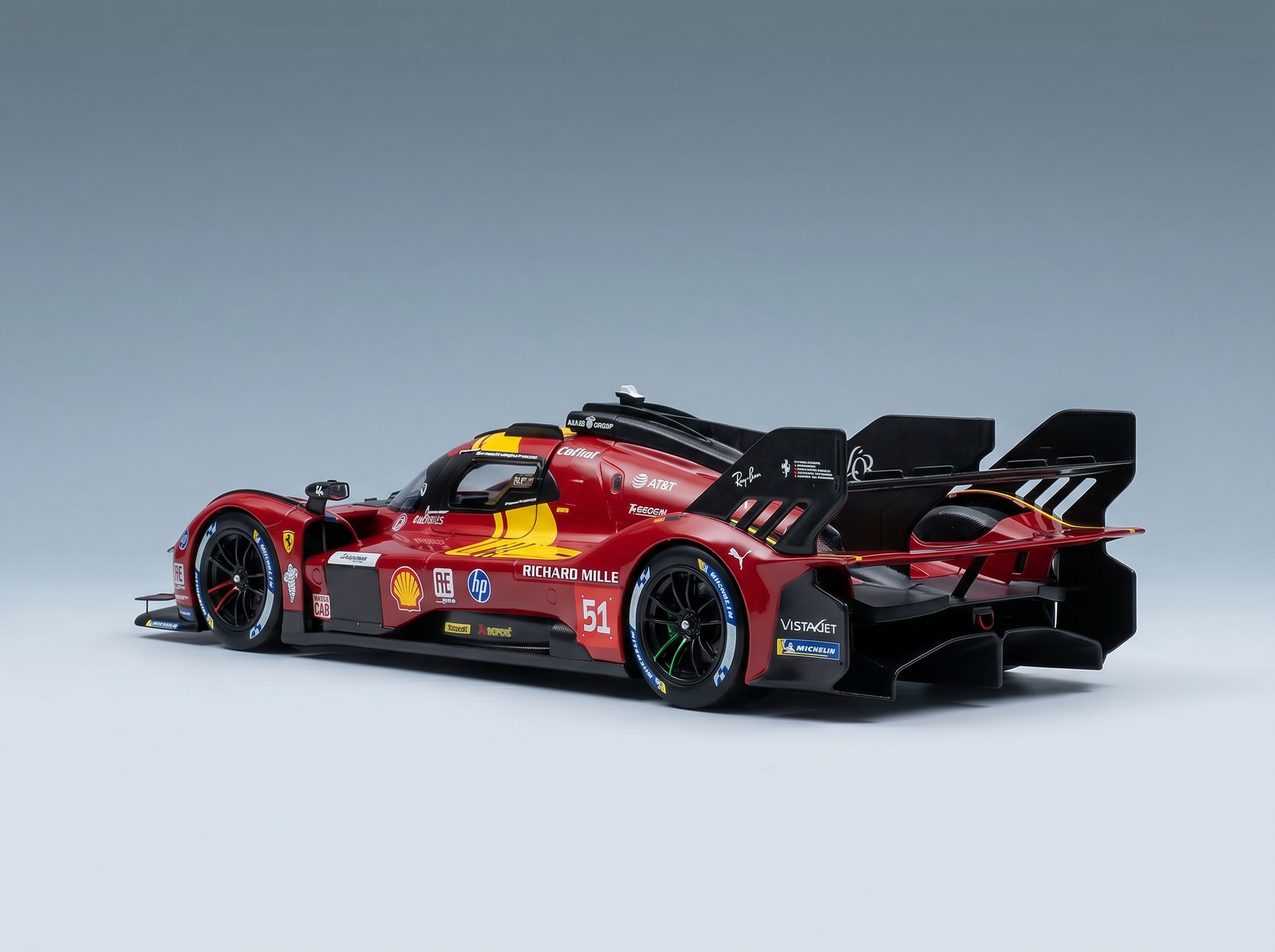 Red Ferrari 51 scale model car with sponsor decals, showcased for Vroomi collectors