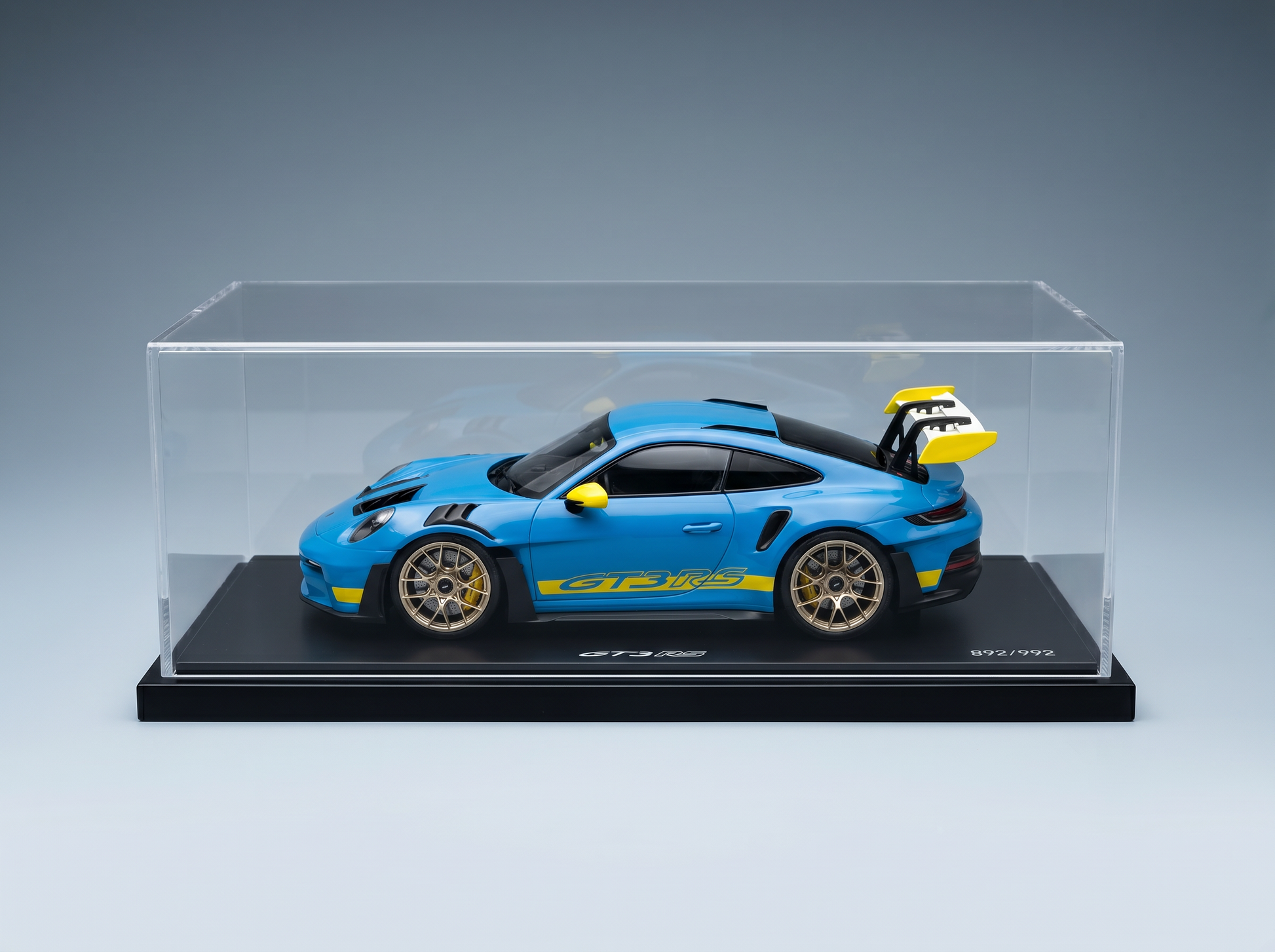 Blue Porsche GT3 RS scale model car in clear display case, limited edition 892/992, from Vroomi