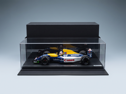 Maquette de la Williams FW14B de la marque Vroomi, arborant les couleurs de Canon, Elf et Labatt's, présentée dans une vitrine