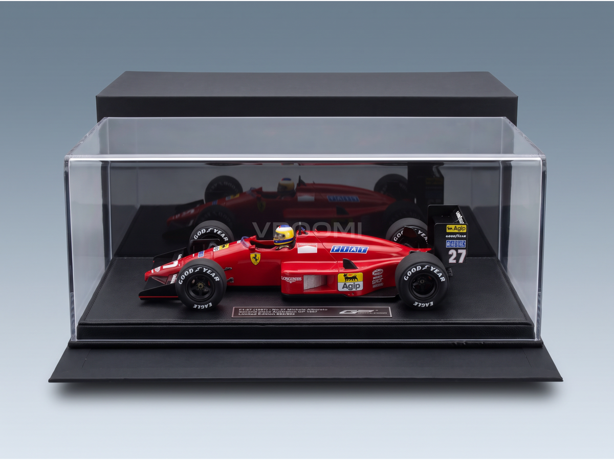 Red Ferrari F1-87 scale model car, No.27 Michele Alboreto, displayed in clear case. Vroomi collector's edition.
