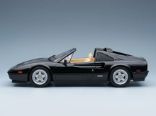 Black Ferrari scale model car with tan interior, showcased by Vroomi for collectors