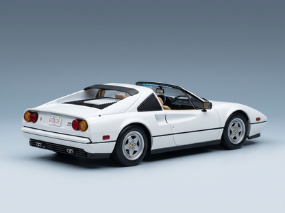 White Ferrari 328 GTS scale model car from Vroomi, detailed die-cast replica with tan interior and California plate