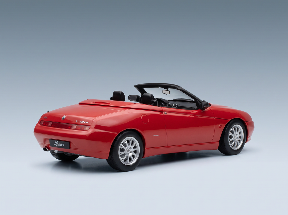 Red Alfa Romeo Spider 2.0 T.Spark scale model car from Vroomi, showcasing detailed convertible design and alloy wheels.