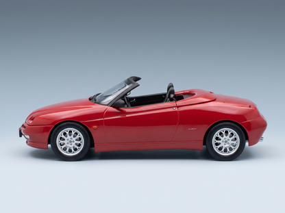 Red Alfa Romeo Spider scale model car from Vroomi, showcasing sleek convertible design and detailed alloy wheels.