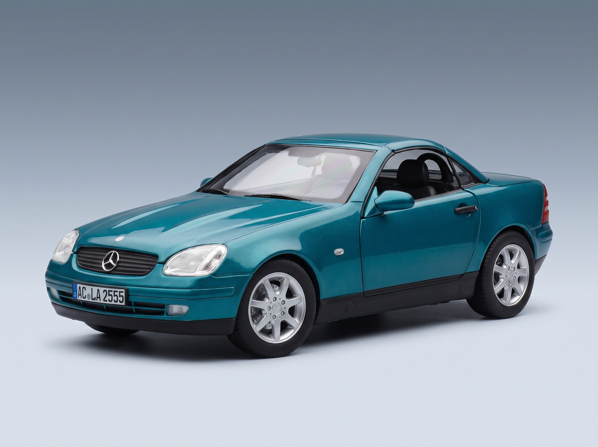 Teal Mercedes-Benz SLK scale model car from Vroomi, featuring detailed wheels and classic design