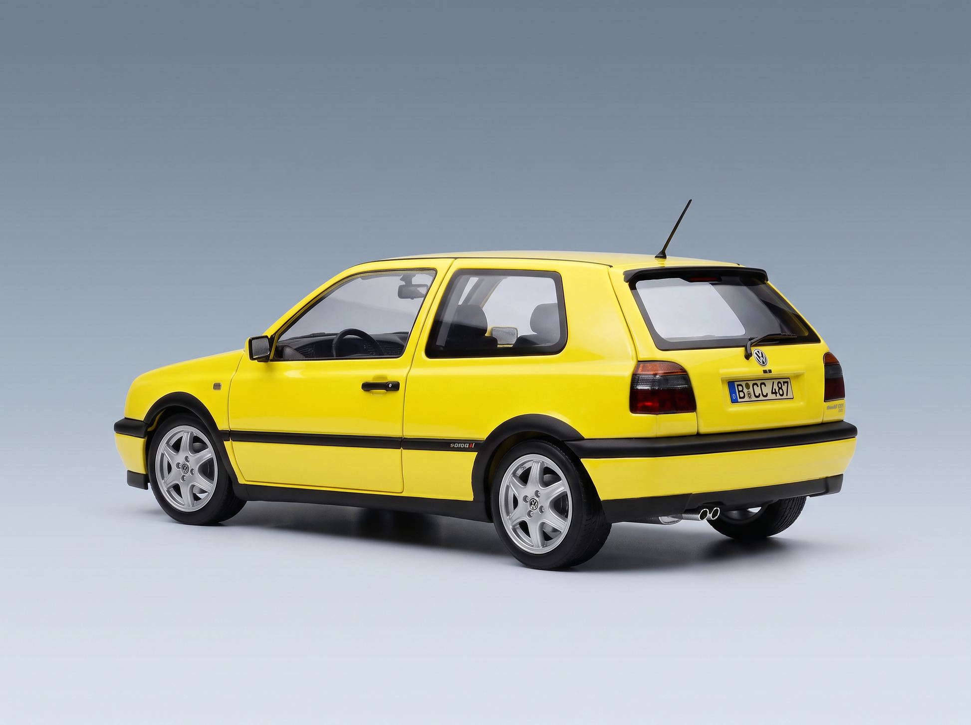 Vroomi yellow Volkswagen Golf GTI scale model car with black trim and silver wheels