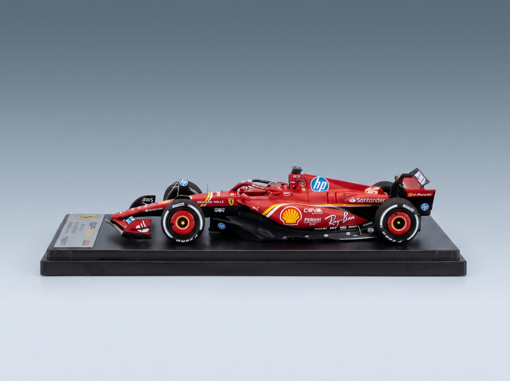 Red Ferrari F1 scale model car with Shell, HP, Santander logos, displayed on black base — Vroomi
