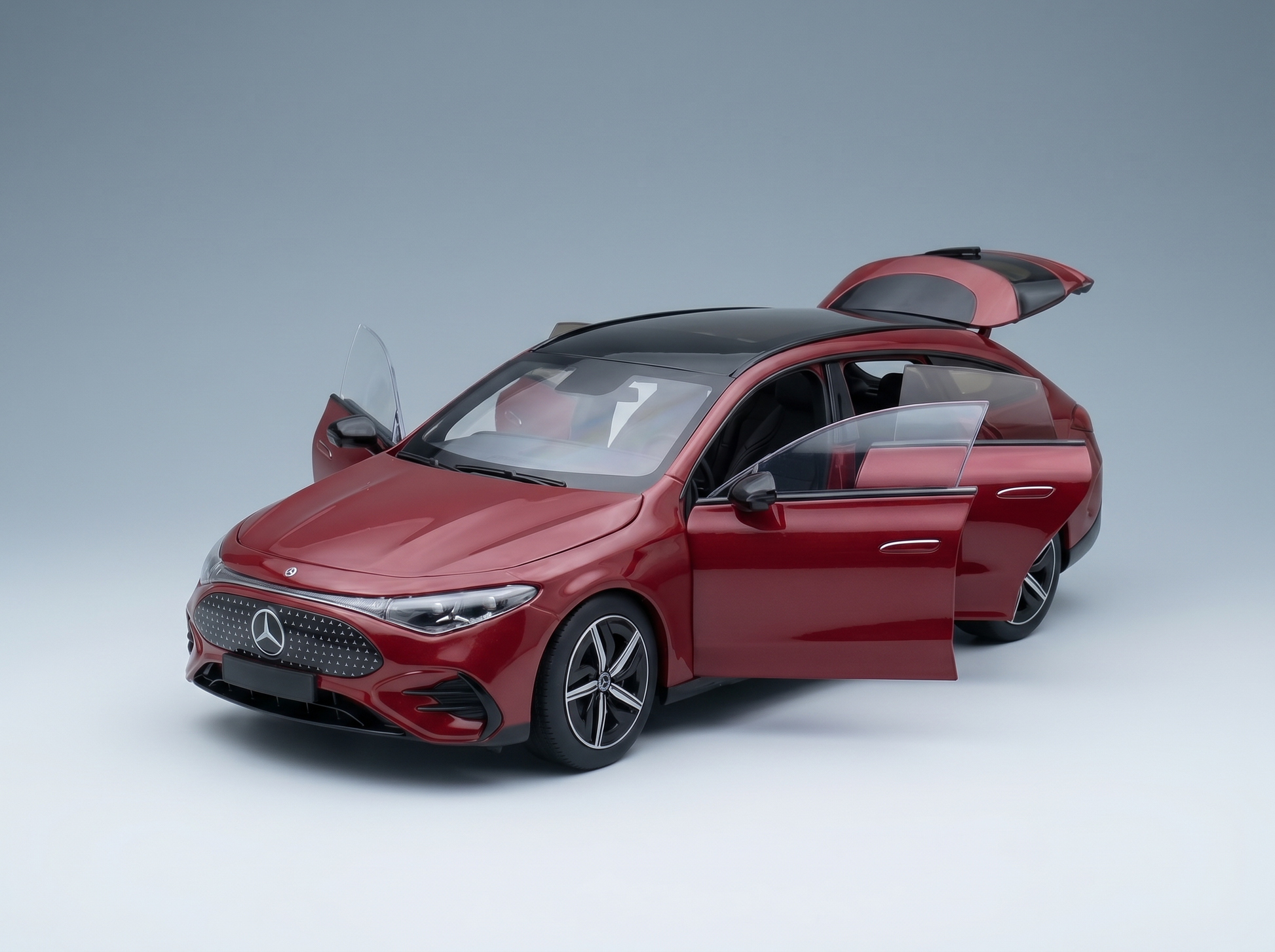 Red Mercedes-Benz scale model car with open doors, showcased by Vroomi for collectors.