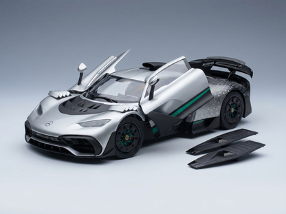 Silver Mercedes-AMG scale model car with open doors, showcased by Vroomi for collectors.