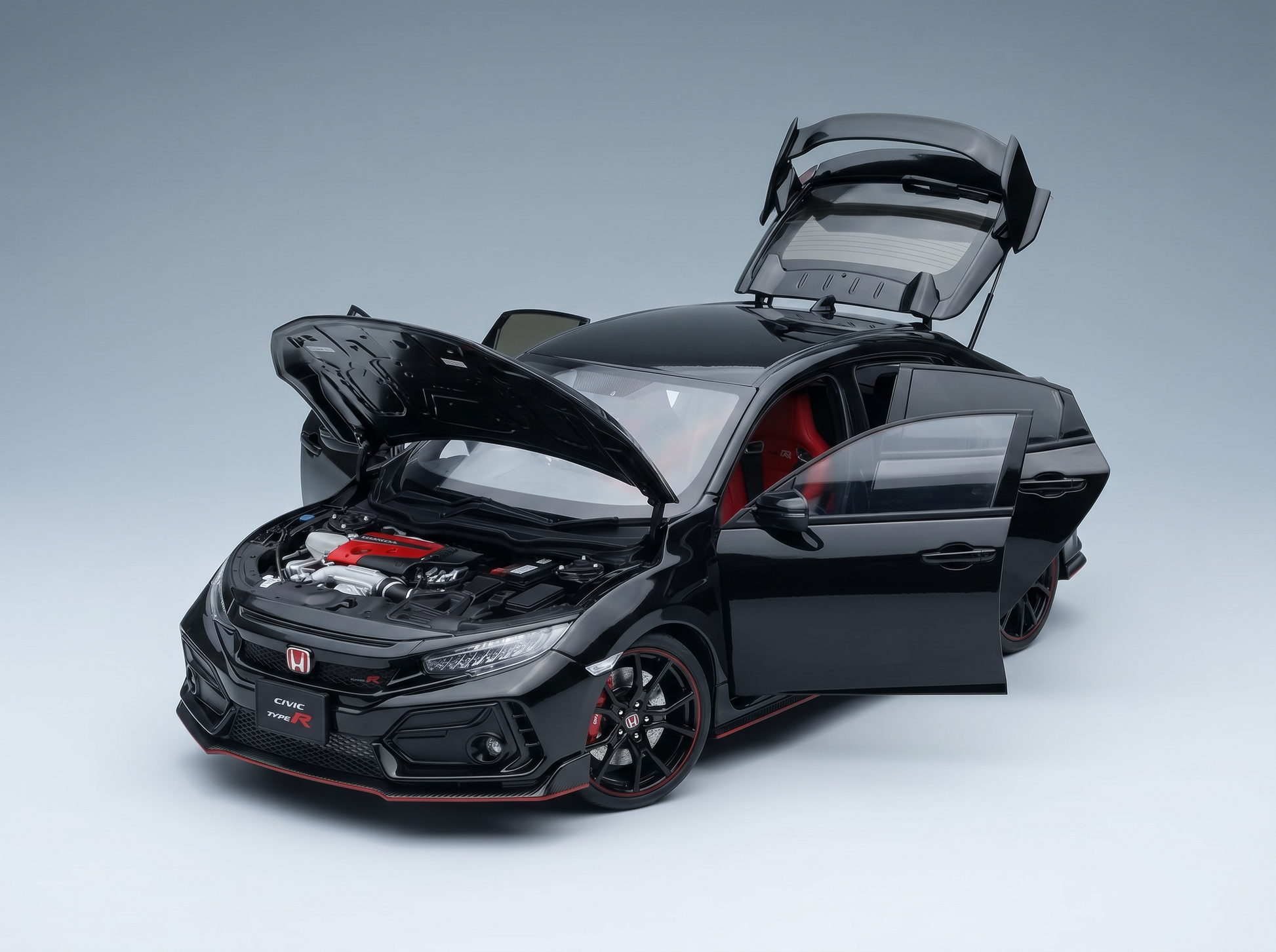 Black Honda Civic Type R scale model car with open doors, hood, and trunk, showcased at Vroomi