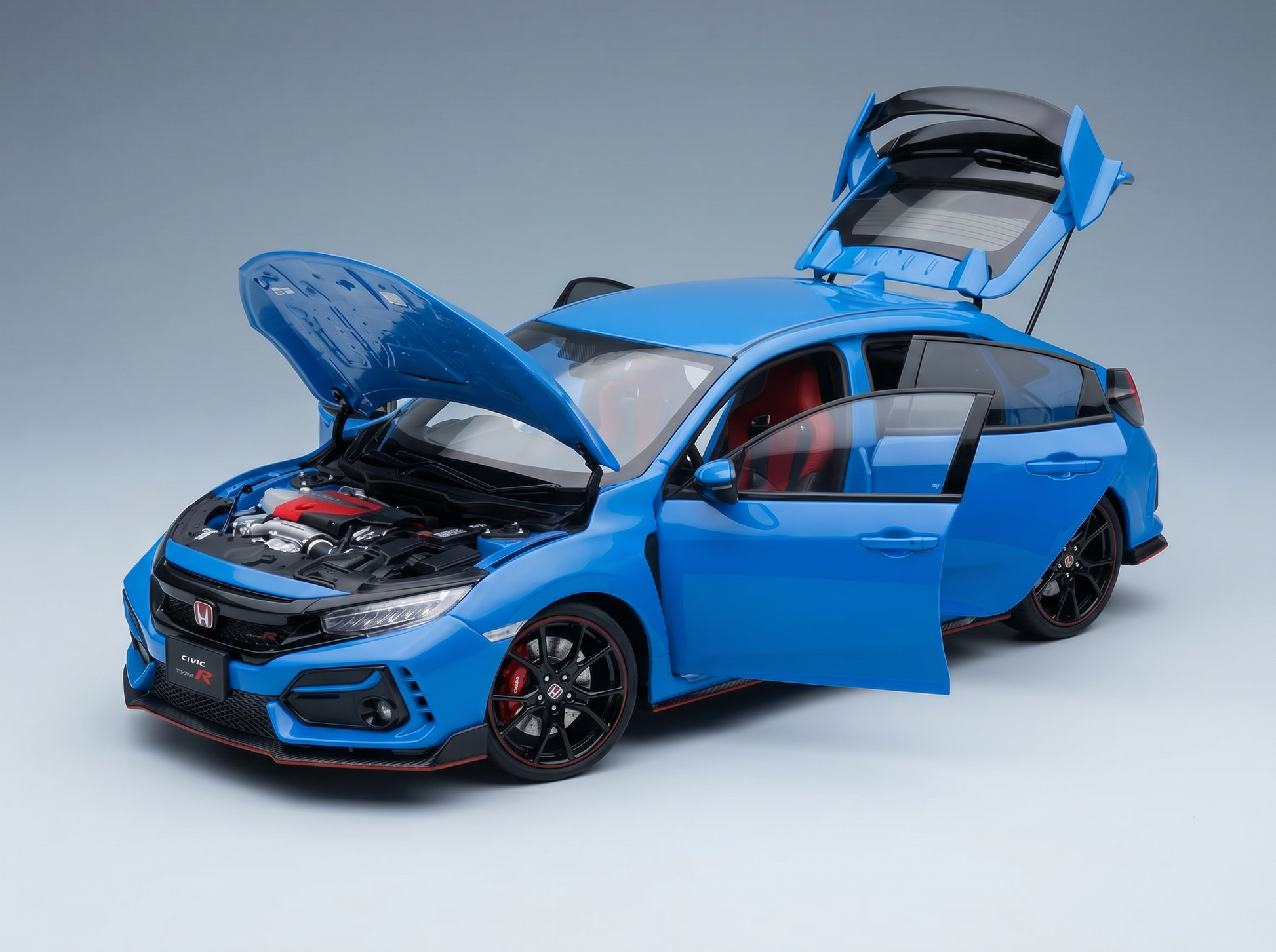Blue Honda Civic Type R scale model car with open doors, hood, and trunk, showcased at Vroomi