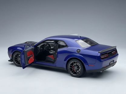 Blue Dodge Challenger scale model car with open door, red interior, at Vroomi