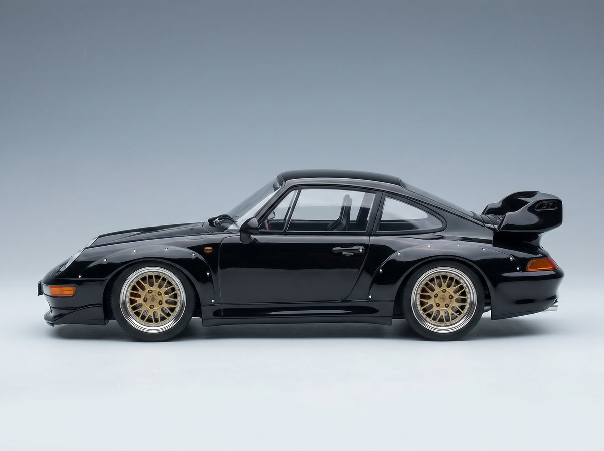 Black Porsche 911 GT2 scale model car with gold rims, showcased by Vroomi for collectors.