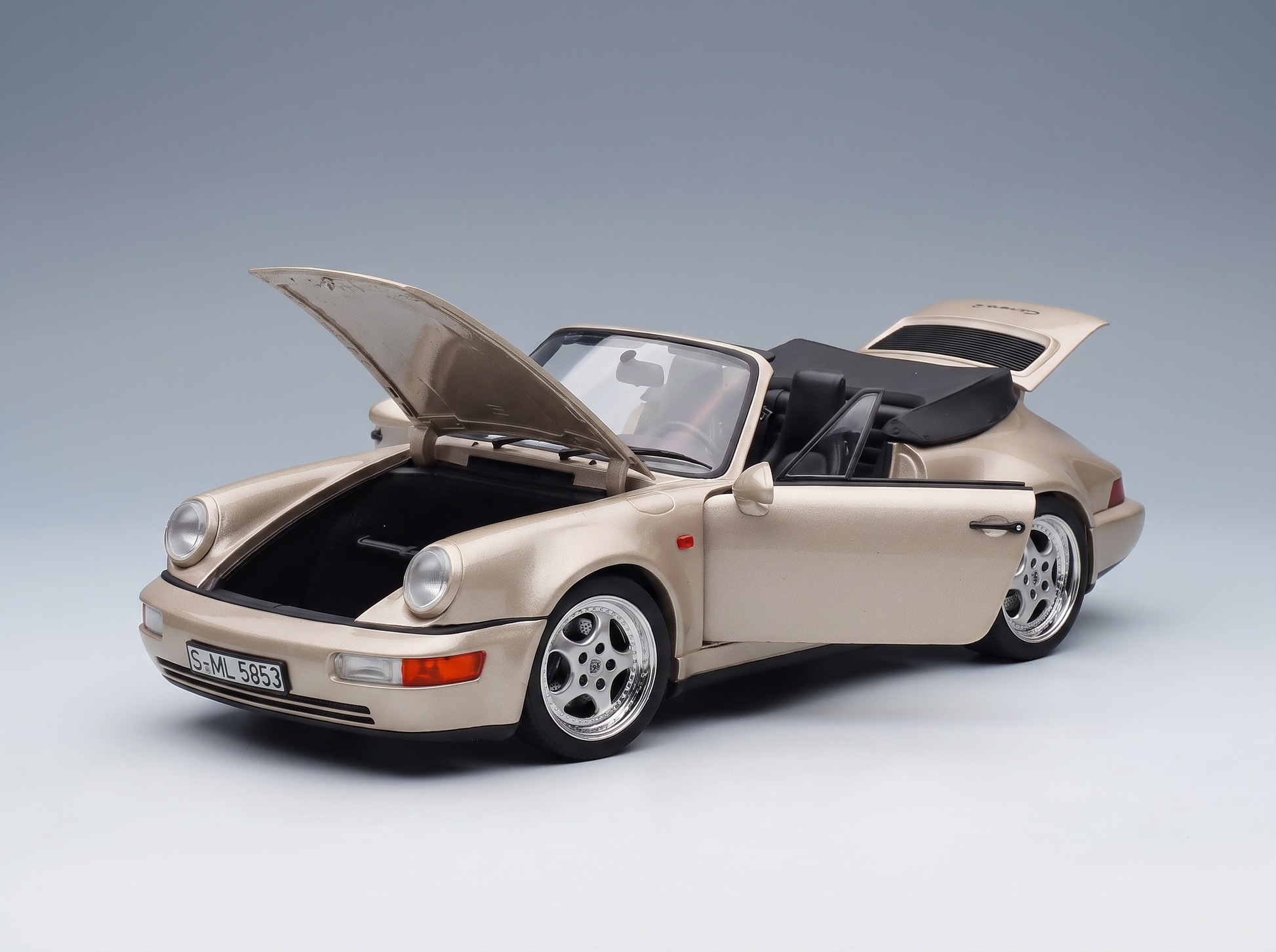Beige Porsche 911 Carrera 2 Cabriolet scale model car with open hood and doors, Vroomi