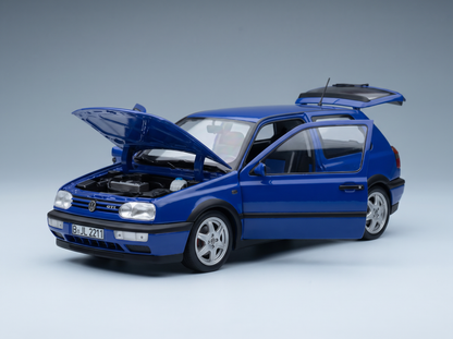Blue Volkswagen GTI scale model car with open hood and doors, detailed engine, Vroomi