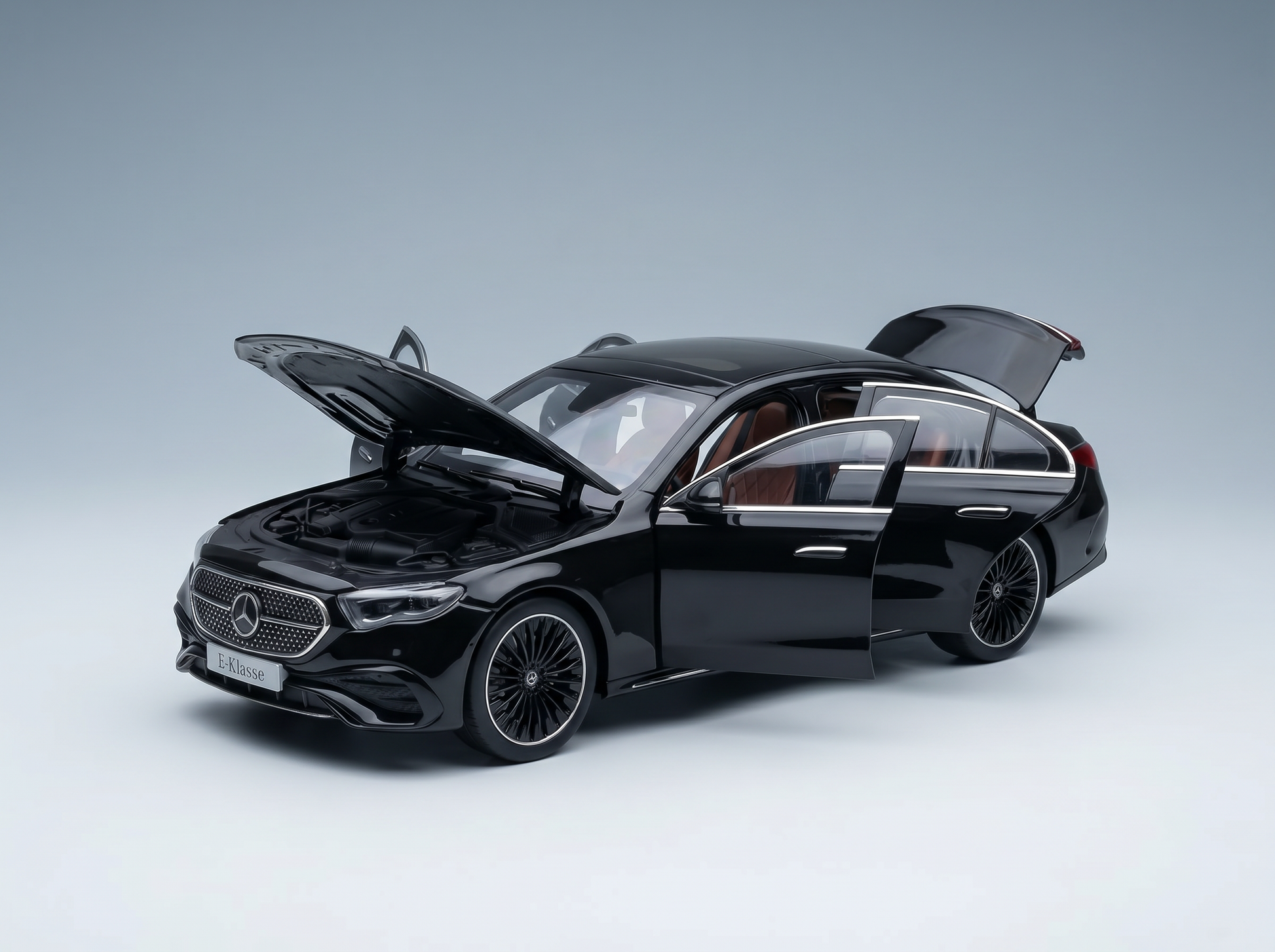 Black Mercedes-Benz E-Klasse scale model car with open doors and hood, showcased by Vroomi for collectors.