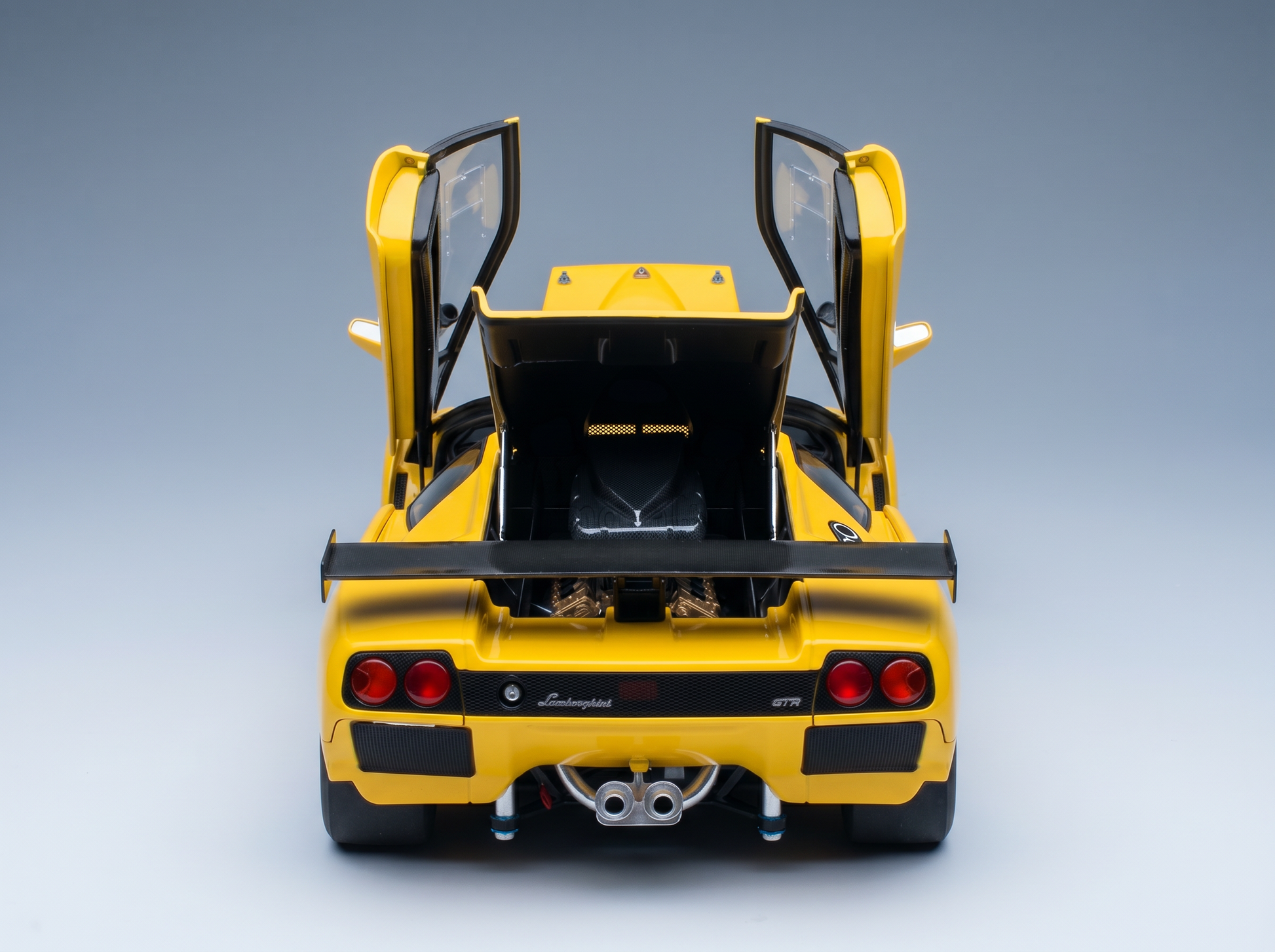 Yellow Lamborghini GTR scale model car with open doors and rear engine bay, Vroomi