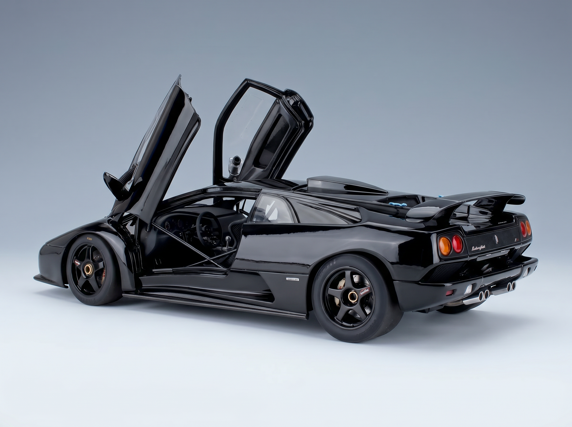 Black Lamborghini Diablo scale model car with doors open, showcased by Vroomi for collectors.