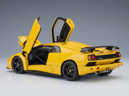 Yellow Lamborghini scale model car with open doors, showcased by Vroomi for collectors