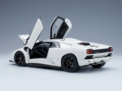 White Lamborghini scale model car with open doors, showcased by Vroomi for collectors.