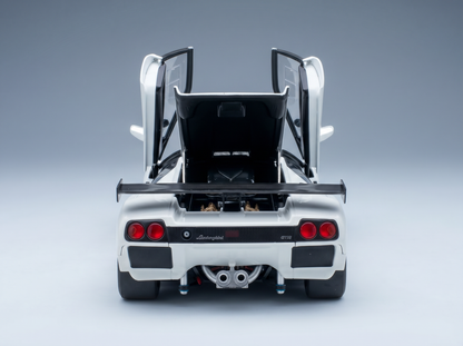 White Lamborghini GT1 scale model car with open doors and rear engine bay, showcased by Vroomi