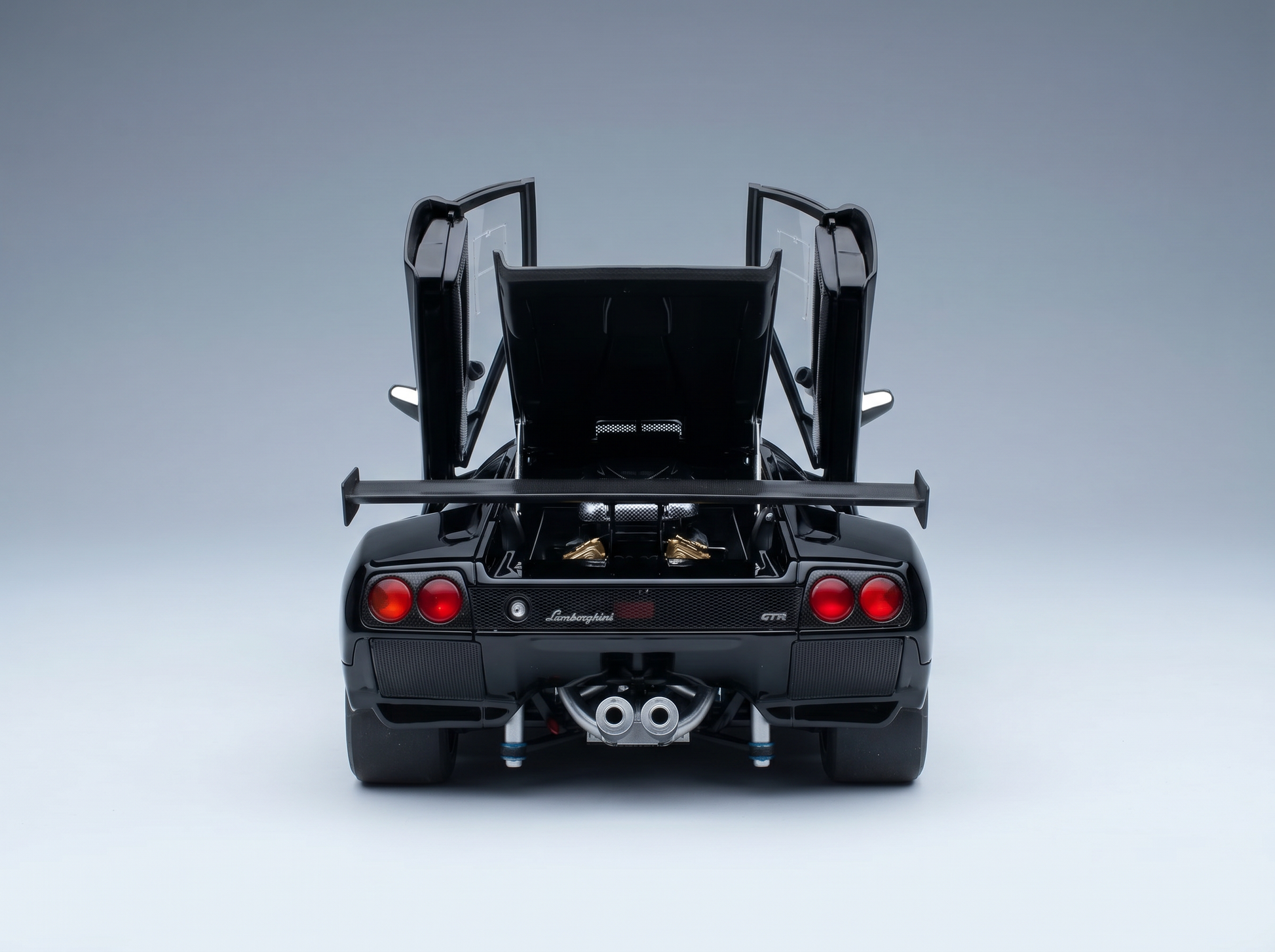 Black Lamborghini GTR scale model car with open doors and rear engine, from Vroomi