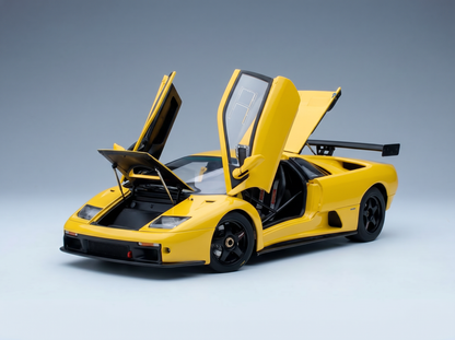 Yellow scale model car with open doors, showcased by Vroomi for collectors and motorsport fans.