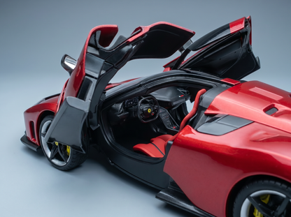 Red Ferrari scale model car with open doors, detailed interior, showcased by Vroomi for collectors
