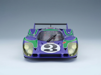 Purple and green scale model car with number 3, showcased by Vroomi for collectors.
