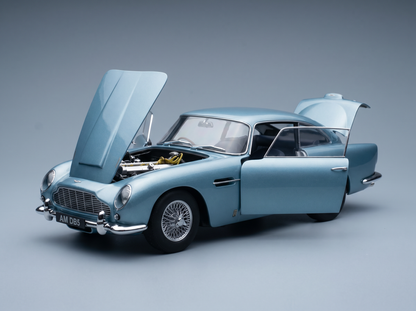 Light blue Aston Martin DB5 scale model car with open hood and doors, detailed engine, from Vroomi