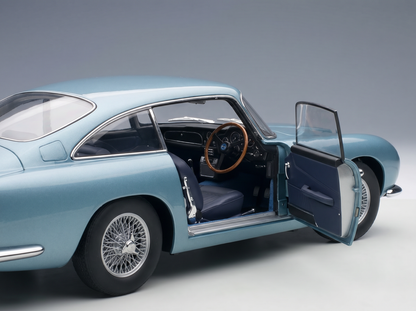 Light blue scale model car with open door, detailed interior, wire wheels — Vroomi collector's replica