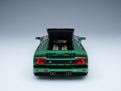 Green scale model car with open rear engine bay, showcased by Vroomi for collectors