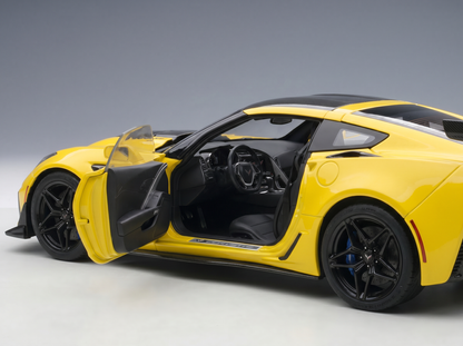 Yellow Corvette scale model car with open doors, detailed interior, black wheels — Vroomi