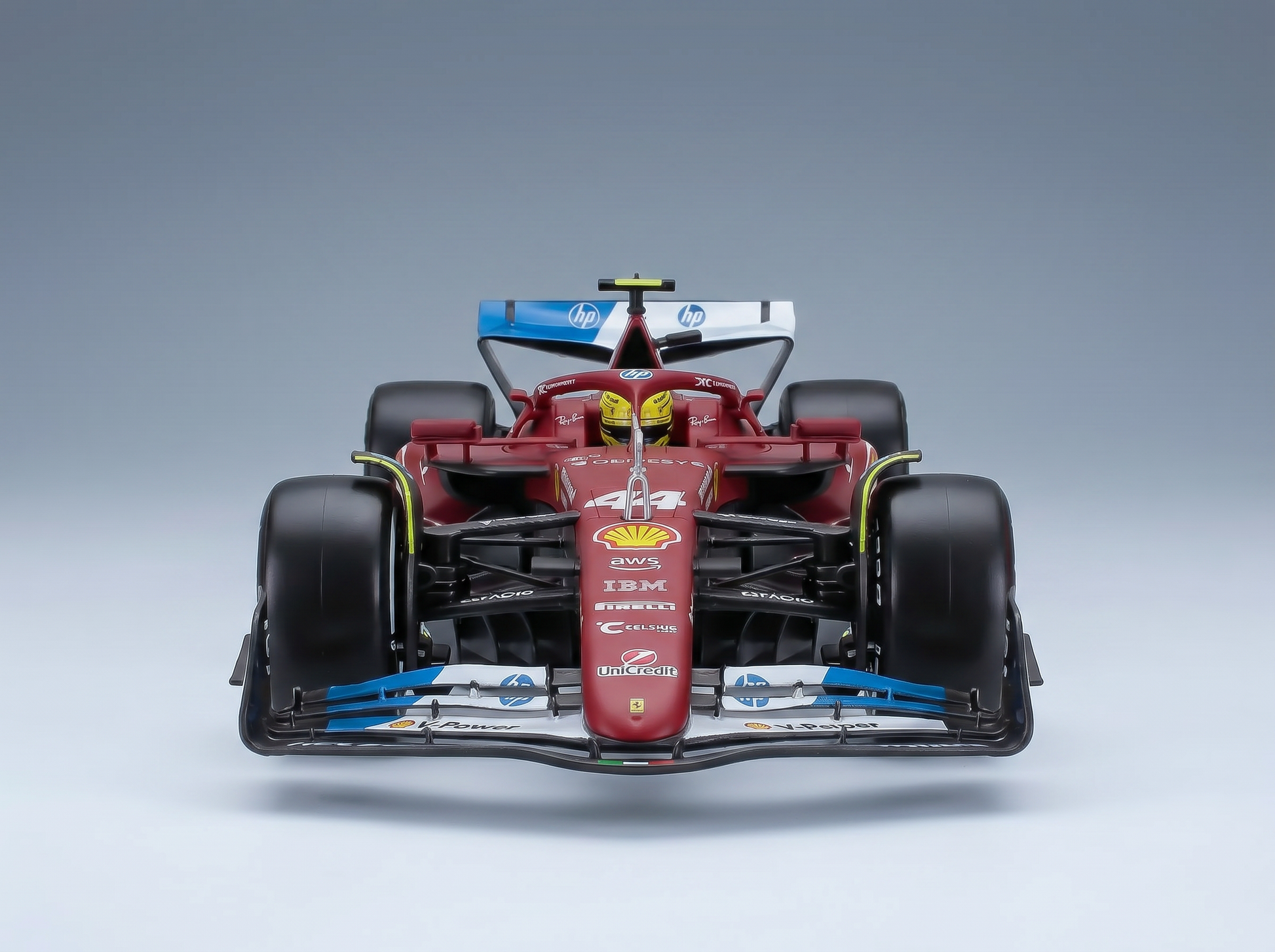 modellino in scala di una Ferrari rossa modellino i marchi HP e Shell, presentato da Vroomi per i collezionisti.