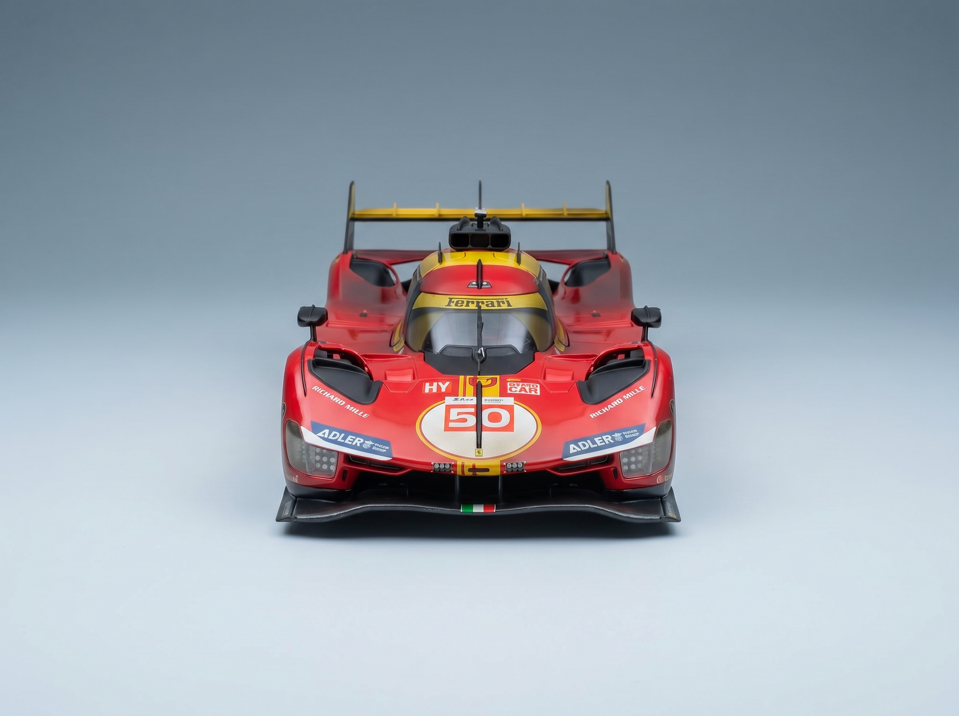 Red Ferrari 50 scale model car with racing decals, showcased by Vroomi for collectors and motorsport fans.